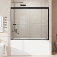 Core matte black framed double sliding bathtub door installed over a bathtub