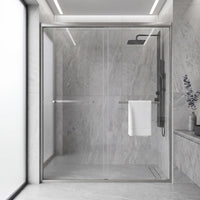 Core brushed nickel framed double sliding shower door in a tiled bathroom