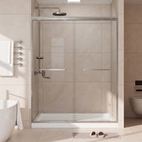 Core brushed nickel framed double sliding shower door installed in a bathroom