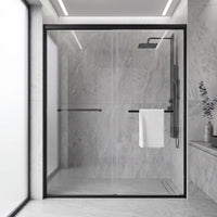 Core matte black framed double sliding shower door in a tiled bathroom