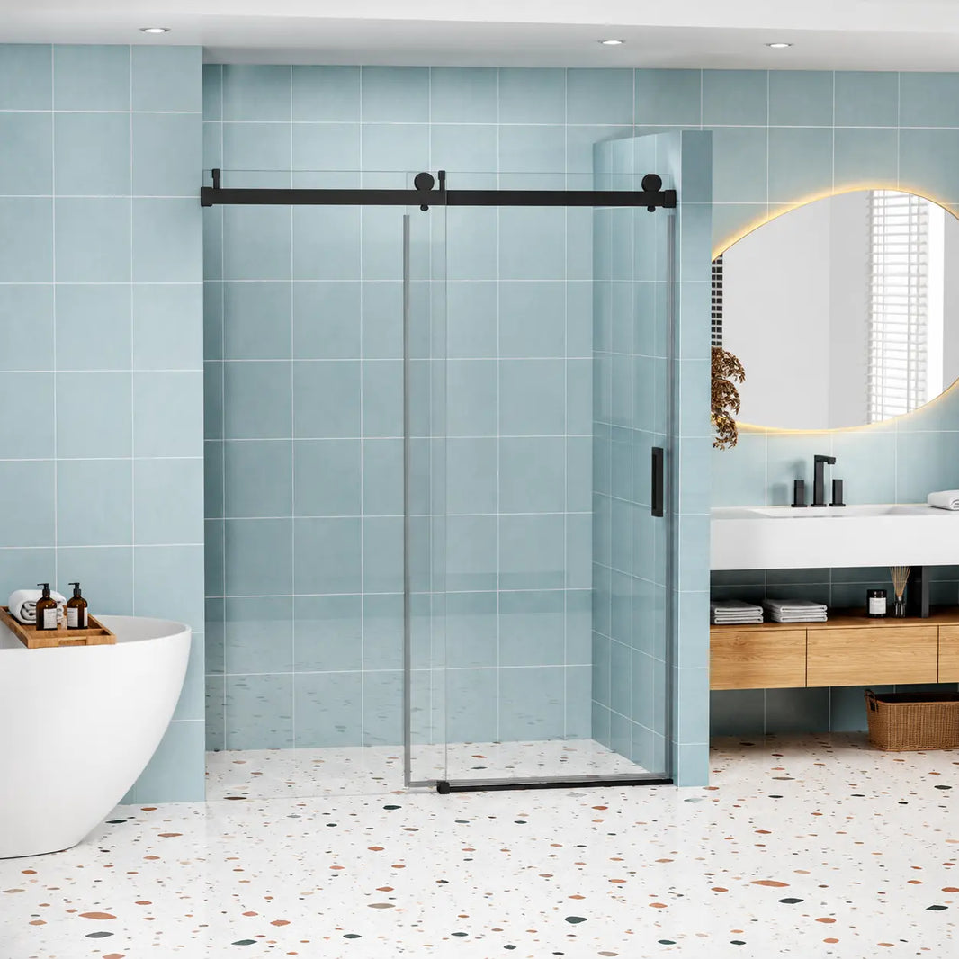 Vanity Decors Astra DJ15 frameless single sliding shower door in Matte Black installed in a modern bathroom