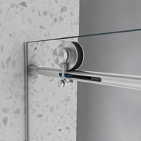 Brushed nickel track hardware on Jade frameless bathtub door