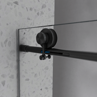 Matte black track hardware on Jade frameless bathtub door