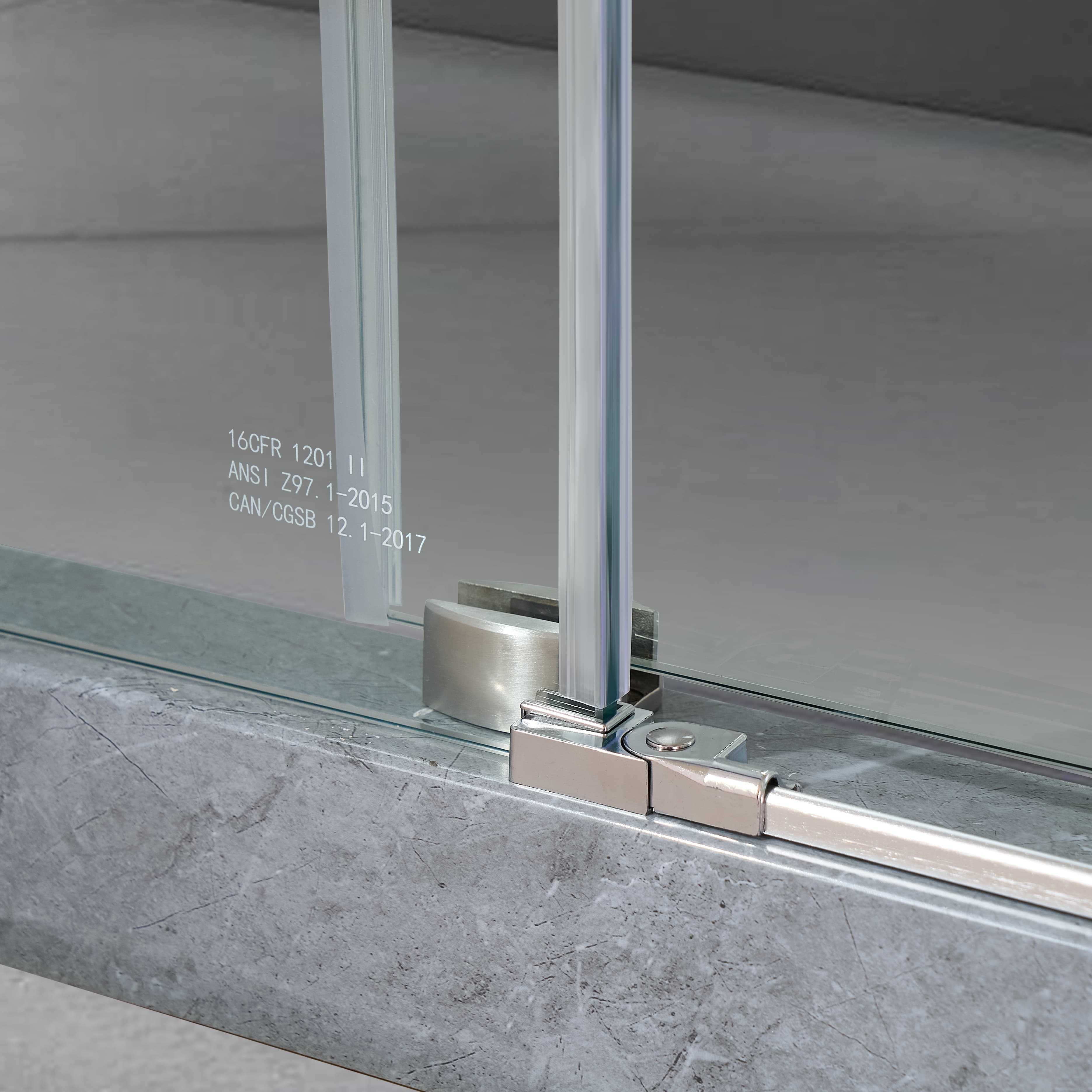 Bottom guide detail on Jade brushed nickel frameless sliding shower door