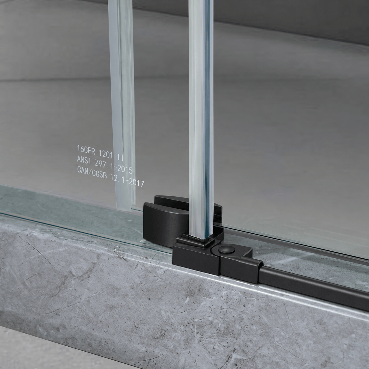 Bottom guide detail on Jade matte black frameless sliding shower door