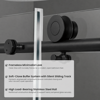 Large stainless steel roller hardware on Jade matte black frameless sliding shower door