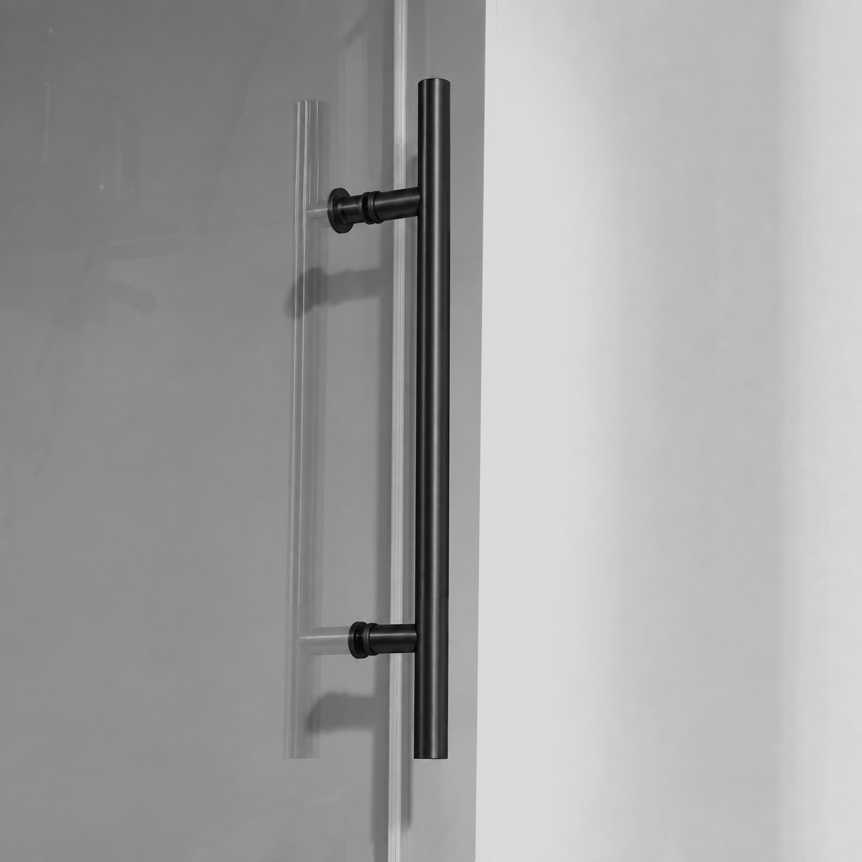 Stainless steel towel bar detail on Jade matte black shower door